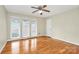 Bedroom featuring hardwood floors, large windows, and a ceiling fan at 3200 Highview Rd, Charlotte, NC 28210