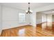 Dining room with hardwood floors and a stylish chandelier, perfect for Gathering dinners at 3200 Highview Rd, Charlotte, NC 28210