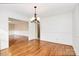 Bright dining area featuring hardwood floors and a modern chandelier at 3200 Highview Rd, Charlotte, NC 28210