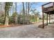 Long private driveway leading to the home, surrounded by mature trees and landscaping at 3200 Highview Rd, Charlotte, NC 28210