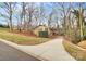 Charming single-story home with brick facade, mature trees, and a long driveway at 3200 Highview Rd, Charlotte, NC 28210