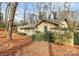 Brick home with mature landscaping, a large window, and a well-manicured yard at 3200 Highview Rd, Charlotte, NC 28210