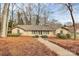 Charming brick home featuring a well-manicured lawn and inviting walkway at 3200 Highview Rd, Charlotte, NC 28210