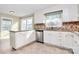 Well-lit kitchen featuring granite countertops, stainless steel appliances, and ample cabinet space at 3200 Highview Rd, Charlotte, NC 28210