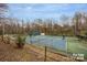 Community tennis courts with surrounding fence and lush greenery at 3200 Highview Rd, Charlotte, NC 28210