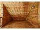 Cozy attic featuring wooden walls and flooring, offering rustic charm at 3640 Oak Haven Ln, Shelby, NC 28150