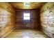 Bedroom featuring wood walls and hardwood floors at 3640 Oak Haven Ln, Shelby, NC 28150