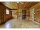 Bedroom featuring knotty pine walls, wood floors, and closet at 3640 Oak Haven Ln, Shelby, NC 28150
