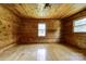 Cozy bedroom with knotty pine walls, hardwood floors and natural light at 3640 Oak Haven Ln, Shelby, NC 28150