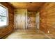 Bedroom featuring wood walls, wood flooring and closet at 3640 Oak Haven Ln, Shelby, NC 28150