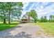 Charming home with covered porch and lush surroundings, featuring a long driveway at 3640 Oak Haven Ln, Shelby, NC 28150