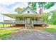 Charming home featuring a covered porch, stone steps and a brick chimney at 3640 Oak Haven Ln, Shelby, NC 28150