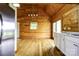 Kitchen with wood walls, stainless steel appliances and light countertops, creating a rustic and modern feel at 3640 Oak Haven Ln, Shelby, NC 28150