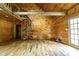 Open living area with wood walls, spiral staircase and beam, creating rustic charm at 3640 Oak Haven Ln, Shelby, NC 28150