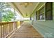 Inviting, covered porch with wood flooring, ceiling fans and picturesque views of the property at 3640 Oak Haven Ln, Shelby, NC 28150
