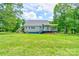 This lovely home features a covered porch and private rear entrance, set within a spacious yard at 3640 Oak Haven Ln, Shelby, NC 28150