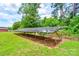 Solar panel system installation in a green yard on a sunny day with blue skies at 3640 Oak Haven Ln, Shelby, NC 28150