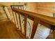 Wooden spiral staircase featuring railings for safety, providing a rustic staircase at 3640 Oak Haven Ln, Shelby, NC 28150