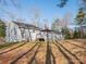Back of home featuring a deck area, perfect for outdoor relaxation and enjoying the serene backyard setting at 3711 Davis Dr, Charlotte, NC 28270