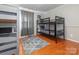Spacious bedroom with hardwood floors, a bunk bed, and a gray rug, great for multiple  at 3711 Davis Dr, Charlotte, NC 28270