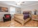 Comfortable bedroom with hardwood floors, ample natural light, and tasteful furnishings at 3711 Davis Dr, Charlotte, NC 28270