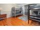 Spacious bedroom with hardwood floors, a bunk bed, and a gray rug, great for multiple  at 3711 Davis Dr, Charlotte, NC 28270