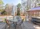 Spacious deck with an outdoor dining area and a hot tub, perfect for relaxation and entertaining at 3711 Davis Dr, Charlotte, NC 28270