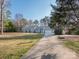 Lovely light-blue single-story home with a basketball hoop and attached garage at 3711 Davis Dr, Charlotte, NC 28270