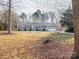 Charming single-story home with a manicured lawn, attached garage, and mature trees in a peaceful neighborhood at 3711 Davis Dr, Charlotte, NC 28270