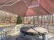 A luxurious hot tub on a spacious deck, surrounded by trees, offering relaxation and privacy at 3711 Davis Dr, Charlotte, NC 28270