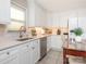 Bright kitchen featuring white cabinetry, stainless steel appliances, and a cozy breakfast nook at 3711 Davis Dr, Charlotte, NC 28270