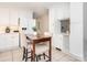 Bright kitchen featuring white cabinetry, stainless steel appliances, and a cozy breakfast nook at 3711 Davis Dr, Charlotte, NC 28270