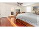 Spacious main bedroom showcasing a luxurious bed, hardwood floors, and stylish decor at 3711 Davis Dr, Charlotte, NC 28270