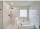 Bathroom features a jetted tub and separate shower with tile surround at 433 Annaberg Ln, Monroe, NC 28110