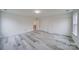 A bright bedroom with sliding closet doors and light gray flooring at 433 Annaberg Ln, Monroe, NC 28110