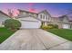 Charming two-story home with a well-maintained lawn, landscaping, and a spacious driveway at 433 Annaberg Ln, Monroe, NC 28110