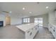Open floor plan features living room with fireplace and kitchen with island at 433 Annaberg Ln, Monroe, NC 28110