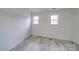 Walk-in closet with two windows and metal shelving at 433 Annaberg Ln, Monroe, NC 28110