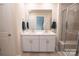 Clean bathroom features double sinks, white cabinets, and a large mirror at 508 Tayberry Ln, Fort Mill, SC 29715