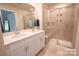 Modern bathroom features double sinks, white cabinets, and glass shower at 508 Tayberry Ln, Fort Mill, SC 29715