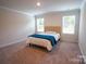 Bright bedroom features plush carpet, neutral walls, and natural light at 508 Tayberry Ln, Fort Mill, SC 29715