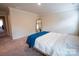 Cozy bedroom features a comfortable bed and a full length mirror at 508 Tayberry Ln, Fort Mill, SC 29715