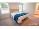 Bedroom with plush carpet, large window, and ensuite bathroom at 508 Tayberry Ln, Fort Mill, SC 29715
