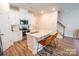 Open kitchen with stainless appliances, an island with bar stool seating, and sleek countertops at 508 Tayberry Ln, Fort Mill, SC 29715