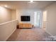Loft area with carpet floors, a tv, and natural light at 508 Tayberry Ln, Fort Mill, SC 29715