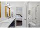 Modern bathroom with stylish fixtures and a glimpse into a bright, airy bedroom at 5231 Lila Wood Cir, Charlotte, NC 28209
