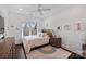 Sunlit bedroom with a ceiling fan and a neutral color palette at 5231 Lila Wood Cir, Charlotte, NC 28209