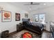Inviting bedroom with a ceiling fan, a modern bed, and decor for the sports enthusiast at 5231 Lila Wood Cir, Charlotte, NC 28209