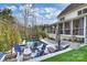 The outdoor area features a pool with elegant tiling, comfortable lounge furniture, and a screened-in porch at 5231 Lila Wood Cir, Charlotte, NC 28209
