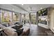 Relaxing screened-in porch with outdoor seating and a cozy fireplace at 5231 Lila Wood Cir, Charlotte, NC 28209